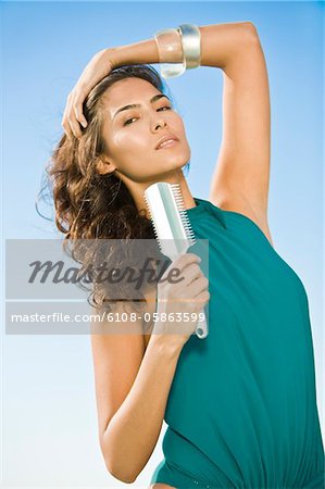 Woman holding a comb