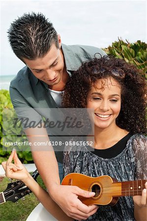 Couple playing ukulele