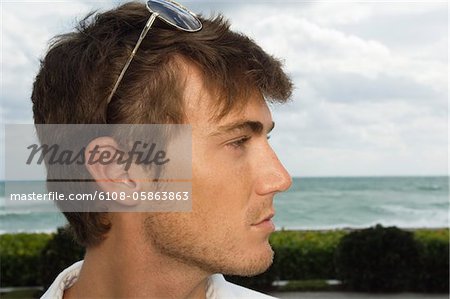 Close-up of a man with sunglasses on his head