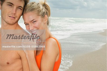 Portrait of a couple smiling on the beach