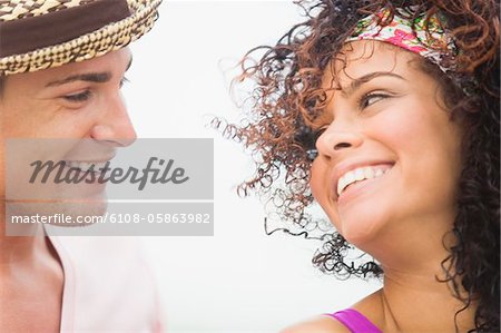 Close-up of a couple smiling at each other