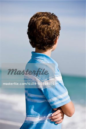 Boy standing on the beach