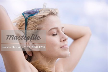 Close-up of a woman day dreaming