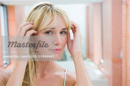 Woman adjusting her hair