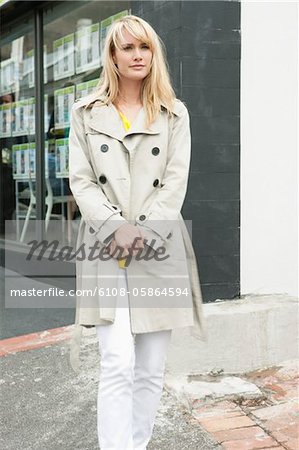 Woman standing on the road and thinking