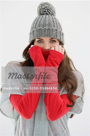 Portrait of a woman covering her face