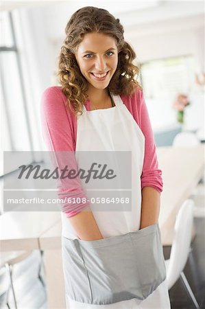 Portrait of a woman standing in the kitchen