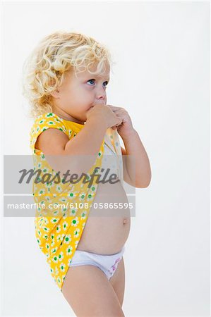 Girl biting her dress