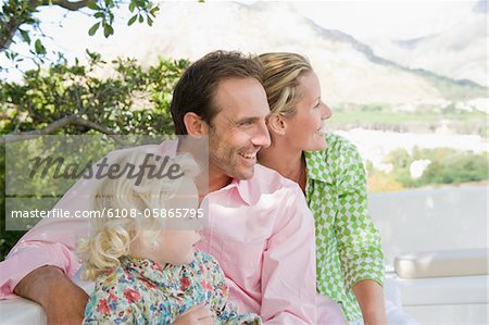 Family smiling on a terrace