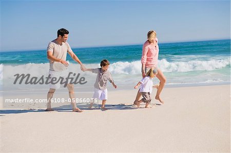 Family enjoying vacations on the beach