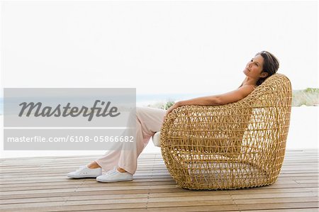 Woman reclining on a chair on the beach