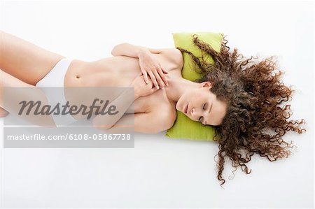 Woman covering her breasts and sleeping