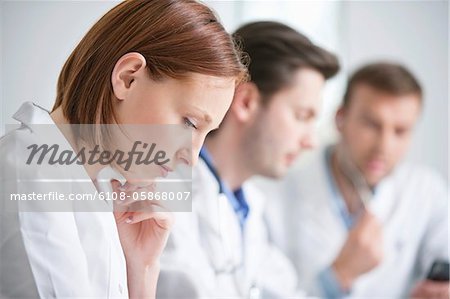 Female doctor working with her colleagues