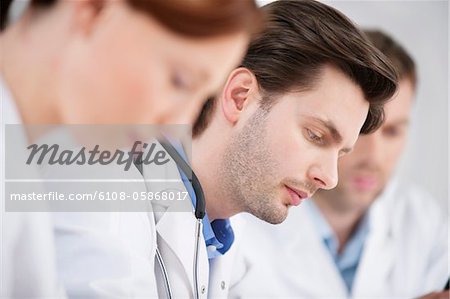 Three doctors working in an office