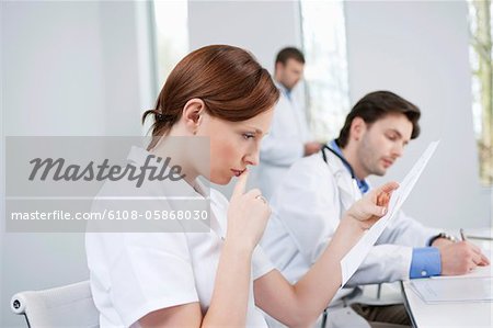 Three doctors working in an office