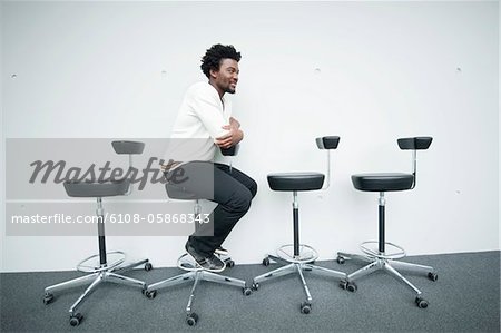 Businessman sitting on a chair and smiling
