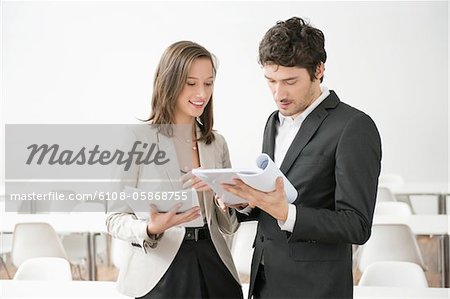 Business executives discussing a document