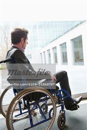 Disabled businessman sitting in a wheelchair