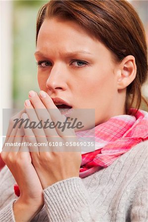 Young woman coughing