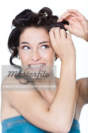 Young woman fixing hair clips