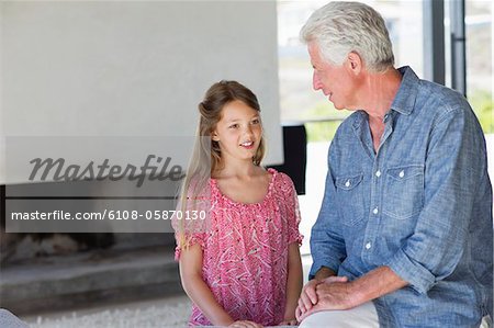 Man talking to his granddaughter