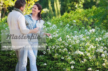 Happy mature couple romancing in a garden