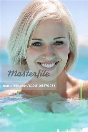 View of beautiful woman smiling in pool