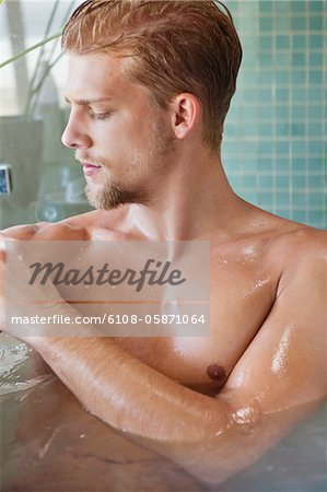 Close-up of a man taking bath
