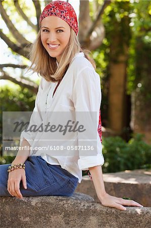 Cheerful young woman wearing bandana