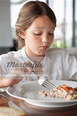 Close-up of girl having food