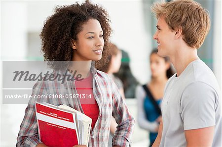Two university students discussing in campus