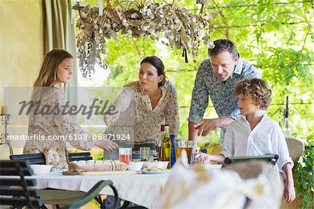 Family preparing for food at house