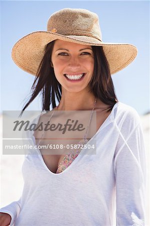 Portrait of a young woman smiling on the beach