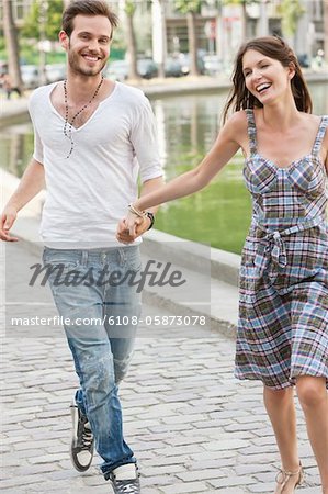 Couple enjoying near a canal, Paris, Ile-de-France, France