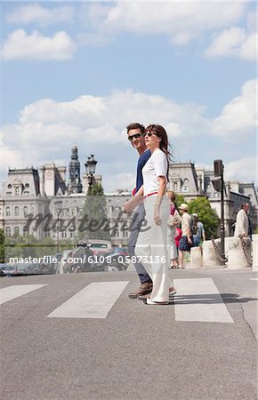 Couple crossing the road, Paris, Ile-de-France, France