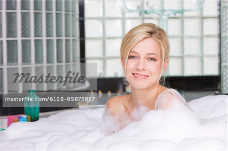 Woman taking a bubble bath