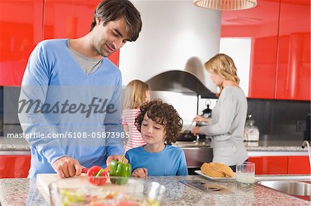 Family cooking food in the kitchen
