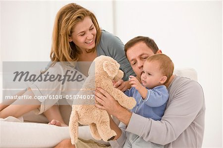 Parents playing with their daughter