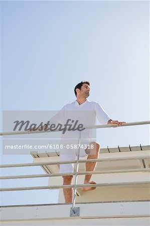 Man standing on the beach house