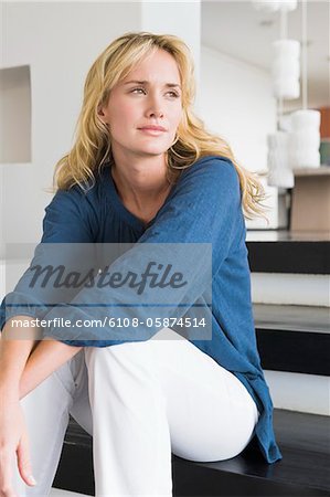 Woman sitting on steps