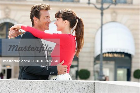 Romantic couple on a street, Paris, Ile-de-France, France