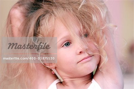 portrait of a beautiful little girl with blond hair