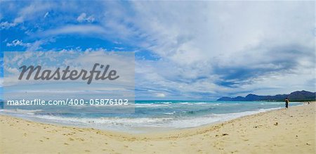 Beautiful blue Beach Mallorca panoramic sea view on a windy day. Waves, sea, clouds, blue sky, concept of vacation