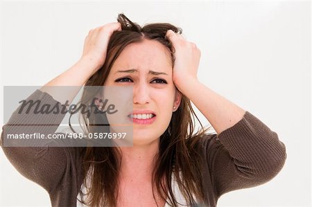 Young panic woman with hands on the head