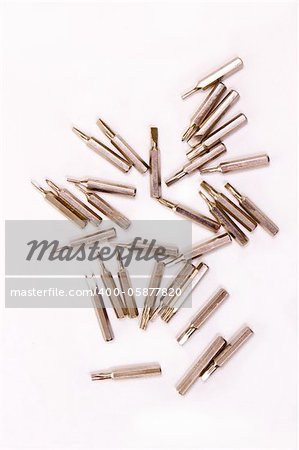 inline metallic screwdriver heads isolated on white