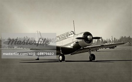 World War II era propeller airplane, faded black and white