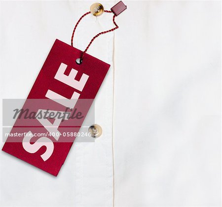 Red Sale Sign on White Shirt - With Copyspace