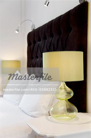 Luxurious modern bed design and bedside lamps