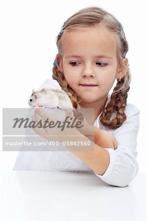 Wait you little devil - little girl catching her runaway hamster