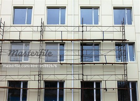 Scaffold against the wall and some windows